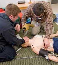 students working with mannequin